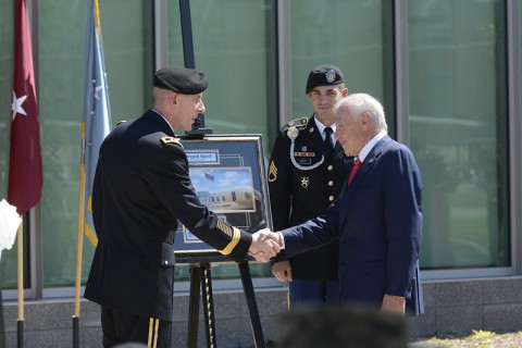 Honorary Chairman of the Intrepid Fallen Heroes Fund, Arnold Fisher (right), receives a framed picture from Maj. Gen. Gary J. Volesky (left) during the dedication of the new Intrepid Spirit Center, on Monday, Sept. 8, 2014 at Fort Campbell, KY. (Dean Dixon/AP Images for AP Images for Intrepid Fallen Heroes)