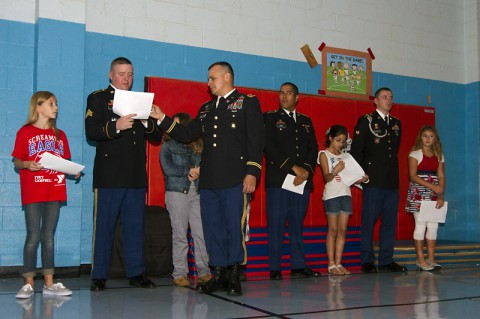 Soldiers from the 101st Special Troops Battalion, 101st Sustainment Brigade, 101st Airborne Division, commemorated the Sept. 11 attacks on the United States with the students and staff at Marshall Elementary School during an assembly Sept. 11 at Fort Campbell, KY. (U.S. Army photo by Sgt. Leejay Lockhart, 101st Sustainment Brigade)