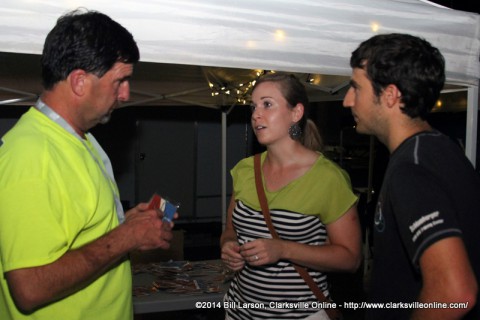 Mayoral candidate Jeff Burkhart speaks with festival attendees at his booth