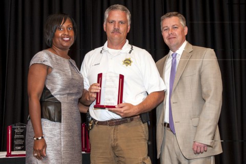 Governor’s Highway Safety Office Assistant Director Mia Vickers (left) and GHSO Director Kendell Poole (right) present Sgt. Jimmy Brown with the Director’s Award.