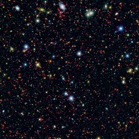 Millions of galaxies populate the patch of sky known as the COSMOS field, short for Cosmic Evolution Survey, a portion of which is shown here. Even the smallest dots in this image are galaxies, some up to 12 billion light-years away. (NASA/JPL-Caltech)