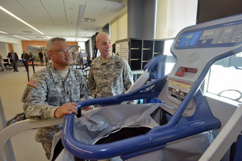 Two Service Members admire the new anti-gravity machine at the Ft. Campbell Intrepid Spirit Center. (Dean Dixon/AP Images for AP Images for Intrepid Fallen Heroes)