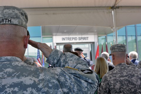 Service members salute during the Intrepid Fallen Heroes Fund dedication of the new Intrepid Spirit Center, on Monday, Sept. 8, 2014 at Fort Campbell, KY. (Dean Dixon/AP Images for AP Images for Intrepid Fallen Heroes)