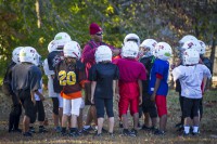 U.S. Army Sgt. 1st Class Christopher Roberts, food service sergeant with 3rd Battalion, 5th Special Forces Group (Airborne), talks to the children of his football team, Oct. 21, 2014. The team he coaches is part of the Bud Hudson Youth Football League of the Boys and Girls Club of America in Christian County, Ky. (Sgt. Justin A. Moeller/U.S. Army)