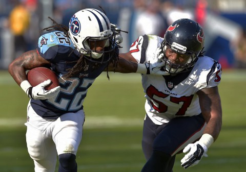 Tennessee Titans running back Dexter McCluster (22) carries the ball against Houston Texans linebacker Justin Tuggle (57) during the second half at LP Field. The Texans beat the Titans 30-16. (Don McPeak-USA TODAY Sports)