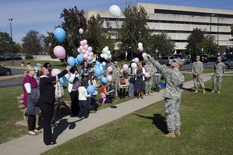 During a Walk To Remember ceremony at Blanchfield Army Community Hospital, Chaplain (Maj.) Thomas Gidley leads attendees in a balloon release to honor the memories of babies lost. (U.S. Army photo by David E. Gillespie)