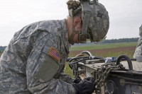 Spc. Anastasia M. Gilliam, a native of Modesto, CA, and a unit supply specialist with the 584th Support Maintenance Company “Warpath,” 129th Combat Sustainment Support Battalion, 101st Sustainment Brigade, 101st Airborne Division (Air Assault), ties together a chain link with a nylon cord to avoid loose chains as she rigs a generator during a field training exercise, Sept. 18, 2014, at Fort Campbell, Ky. The Soldiers of the 584th are training on how to properly and effectively rig their equipments. (Sgt. Sinthia Rosario, 101st Sustainment Brigade Public Affairs)