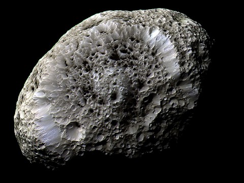Cassini obtained this false-color view of Saturn's chaotically tumbling moon Hyperion during a flyby on Sept. 26, 2005. The spacecraft detected a strong electrostatic charge on the moon's surface, a first for any body other than Earth's moon. (NASA/JPL-Caltech/Space Science Institute)