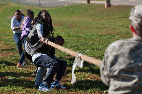 Students from West Creek Middle School in Clarksville, Tenn., take on Soldiers from the 551st Military Police Company, 716th Military Police Battalion, 16th Military Police Brigade, supported by the 101st Sustainment Brigade, 101st Airborne Division, in tug of war Nov. 7 at West Creek Middle School. (U.S. Army photo by Sgt. Leejay Lockhart)