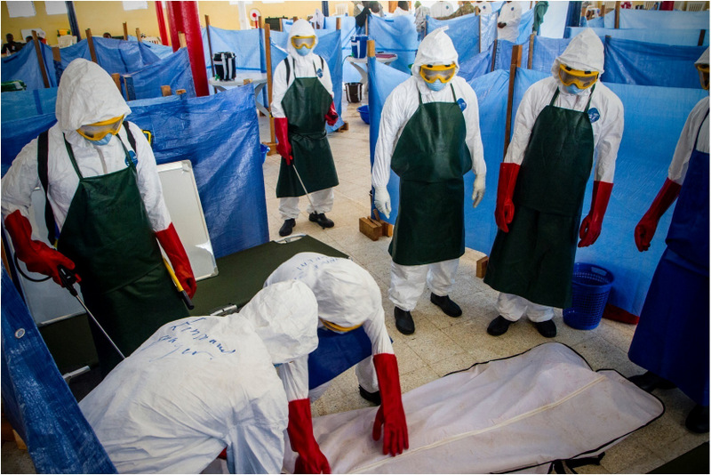 Health care workers learn how to properly dispose of the remains of a simulated patient who died from Ebola in Buchanan City, Nov. 21, 2014. Joint Forces Command – United Assistance mobile training team trains local health care workers on how to properly manage an Ebola treatment unit. Operation United Assistance is a Department of Defense operation in Liberia to provide logistics, training and engineering support to U.S. Agency for International Development-led efforts to contain the Ebola virus outbreak in western Africa. (Staff Sgt. Terrance D. Rhodes/U.S. Army)