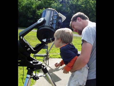 Child viewing through a telescope at Golden Pond Planetarium and Observatory. (Land Between the Lakes)