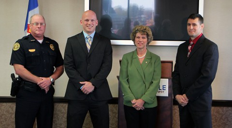 (Left to Right) Deputy Chief Michael Parr, Zachary Baggett, Mayor Kim McMillan, and Randolph Puskas.