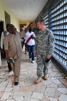 T. Edward Liberty, left, Ph.D., the director general of the Liberian Institute of Statistics – Geo-Information Services, gives a tour of the LISGIS headquarters to Lt. Col. David Conkle, right, the assistant chief of staff of intelligence for JFC-UA, during a meeting Oct. 29, 2014, at the LISGIS headquarters in Monrovia.  (Sgt. 1st Class Nathan Hoskins)
