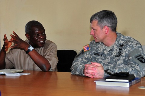T. Edward Liberty, left, Ph.D., the director general of the Liberian Institute of Statistics – Geo-Information Services, discusses his vision of his newfound partnership with the Joint Forces Command – United Assistance geospatial team with Lt. Col. David Conkle, the assistant chief of staff of intelligence for JFC-UA, during a meeting Oct. 29, 2014, at the LISGIS headquarters in Monrovia. (Sgt. 1st Class Nathan Hoskins) T. Edward Liberty, left, Ph.D., the director general of the Liberian Institute of Statistics – Geo-Information Services, discusses his vision of his newfound partnership with the Joint Forces Command – United Assistance geospatial team with Lt. Col. David Conkle, the assistant chief of staff of intelligence for JFC-UA, during a meeting Oct. 29, 2014, at the LISGIS headquarters in Monrovia. (Sgt. 1st Class Nathan Hoskins)