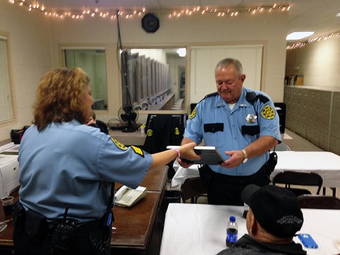 Sgt. Melissa Collins presents Deputy Eugene Hinkle with a plaque after he retired today after 8 years of service to the Montgomery County Sheriff’s Office Workhouse.