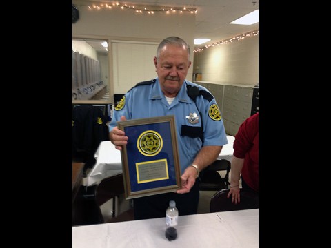 Montgomery County Sheriff's deputy Eugene Hinkle displays his plaque.