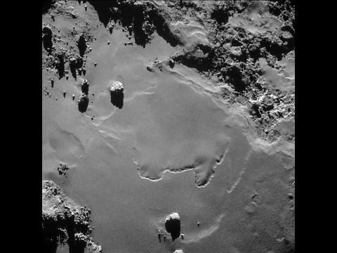 A patch of relatively smooth ground on the nucleus surface of comet 67P/Churyumov-Gerasimenko appears in this image taken by the navigation camera on the European Space Agency's Rosetta spacecraft in October 2014. The image was taken from a distance of less than 6 miles (10 kilometers). (ESA/Rosetta/NAVCAM)