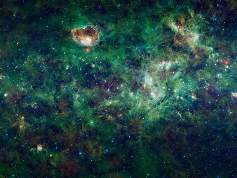 This enormous mosaic of the Milky Way galaxy from NASA's Wide-field Infrared Survey Explorer, or WISE, shows dozens of dense clouds, called nebulae. Many nebulae seen here are places where new stars are forming, creating bubble like structures that can be dozens to hundreds of light-years in size. (NASA)