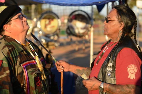 Tony LittleHawk, Cherokee Tribe member, Native American Veterans Association Spiritual Advisor and Sun Walker, and a Vietnam veteran from Marshall, Texas, performs a spiritual cleaning and prayer during the Native American Veterans Association's Annual Veterans Appreciation and Heritage Day Pow Wow in South Gate, California. (Marvin Lynchard/Department of Defense)