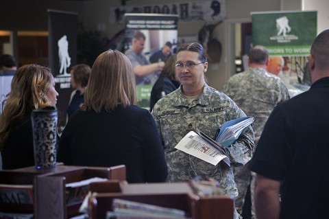 Staff Sgt. Shirley Clingan, a Soldier at Fort Campbell's Warrior Transition Battalion, discusses internship opportunities with Defense Finance and Accounting Service during Operation Warfighter's quarterly career fair at the Soldier and Family Assistance Center Nov. 19. (U.S. Army photo by David E. Gillespie)