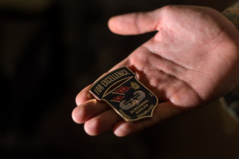 The coin Maj. Gen. Gary Volesky, the Joint Forces Command – United Assistance commander, awards to soldiers for going above and beyond their jobs. (Spc. Rashene Mincy, 55th Signal Company)