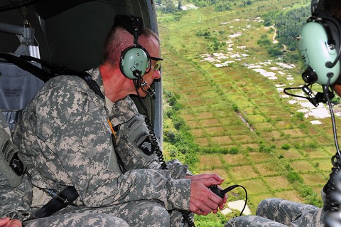 Maj. Gen. Gary Volesky, commander of the Joint Forces Command – United Assistance, surveys the sprawling vegetation of Liberia Nov. 3, 2014, while on his way to Ganta, Liberia, to discuss the site of a future Ebola treatment unit. Volesky traveled with representatives from the Armed Forces of Liberia and the U.S. Agency for International Development, which is the lead agency in the U.S. government and international effort to contain Ebola in West Africa. (U.S. Army photo by Sgt. 1st Class Nathan Hoskins)