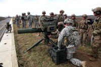 A Special Forces Soldier with the 5th Special Forces Group (Airborne), looks through the optics of a BGM-71 Tube-launched, Optically-tracked, Wire-guided missile, Dec. 9, 2014, prior to firing, during a TOW missile live fire exercise. (U.S. Army photo by Spc. Alexis Concepcion, 5th SFG(A) Combat Camera)