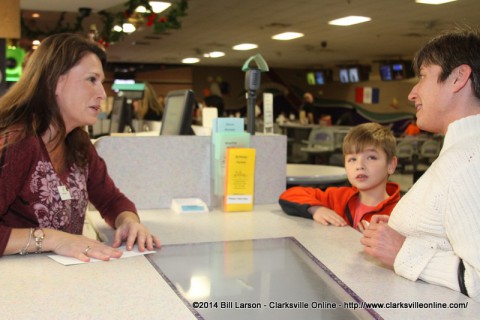 Amy Carroll, the executive director of Big Brothers, Big Sisters manning the counter at the Pinnacle Bowling Alley