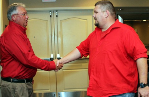 Convenient Car Care Inc. owner Doug Wall, congratulates David Thompson for being awarded "Store of the Year." (Bill Larson/Clarksville Online)