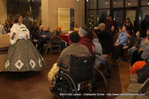 Phyllis Smith from the Friends of Fort defiance talks to the visitors to the Fort Defiance Interpretive Center during Christmas in Occupied Clarksville