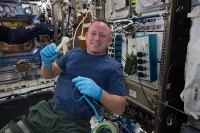 International Space Station Expedition 42 Commander Barry “Butch” Wilmore shows off a ratchet wrench made with a 3-D printer on the station. The wrench and other parts will return to Earth for testing at NASA’s Marshall Space Flight Center in Huntsville, Alabama. (NASA)