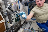 International Space Station astronaut Barry “Butch” Wilmore holds a science sample container that took two hours to make. The container was the first object to be printed with two parts: a lid and a container. NASA wants to make science equipment in space, rather than launching it. (NASA)