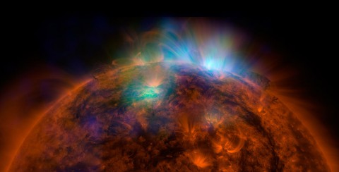 X-rays stream off the sun in this image showing observations from by NASA's Nuclear Spectroscopic Telescope Array, or NuSTAR, overlaid on a picture taken by NASA's Solar Dynamics Observatory (SDO). (NASA/JPL-Caltech/GSFC)