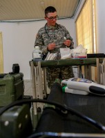 Spc. William Ferguson, native of Oklahoma City, health specialist for Headquarters Support Company, Headquarters and Headquarters Battalion, 101st Airborne Division (Air Assault), takes stock of his supply cart in the Barclay Training Center medical building, Monrovia, Liberia, Jan. 12, 2015. Ferguson said he enjoys the work he does while deployed for Operation United Assistance; he appreciates being able to see the product of his work as a healthcare specialist reflected in the good health of his fellow Soldiers. Operation United Assistance is a Department of Defense operation in Liberia to provide logistics, training and engineering support to U.S. Agency for International Development-led efforts to contain the Ebola virus outbreak in western Africa. (Spc. Caitlyn Byrne/U.S. Army)