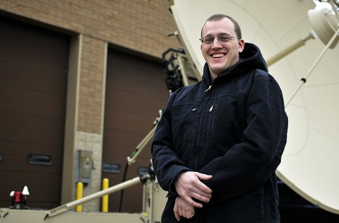 U.S. Air Force Tech. Sgt. Benjamin M. Springsteen, a cyber transport systems specialist with the 264th Combat Communications Squadron, visits his home unit in Peoria, Ill., Dec. 9, 2014, after returning from a deployment to Monrovia, Liberia, in support of Operation United Assistance.  (U.S. Air National Guard photo by Staff Sgt. Lealan Buehrer)