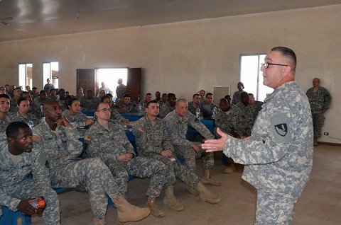 Chaplain Maj. Alfred Grondski, right, a Trenton, N.J., native, of Headquarters and Headquarters Brigade, 36th Engineer Brigade, briefs Soldiers about redeployment stresses they might endure when they get home, during the Operation United Assistance mission, at the National Police Training Academy, Payenesville, Liberia. Dec. 31, 2014. (Sgt. Ange Desinor 13th Public Affairs Detachment)