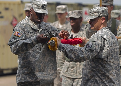 Command Sgt. Maj. Frank Graham, left, senior enlisted adviser for the 101st Special Troops Battalion, 101st Sustainment Brigade, Task Force Lifeliner, the sustainment asset for Joint Forces Command - United Assistance, and Lt. Col. Alexander Gallegos, right, commander, of 101st STB, case their unit colors during a ceremony at Roberts International Airport, located outside Monrovia, Liberia Jan. 26, 2015. (Sgt. 1st Class Mary Rose Mittlesteadt, 101st Sustainment Brigade Public Affairs)