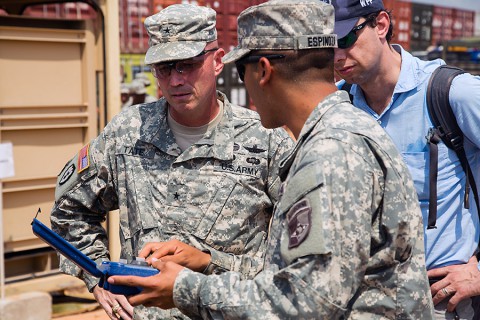 Spc. Eliseio Espinoza, right, a water treatment specialist, assigned to 101st Sustainment Brigade, 101st Airborne Division (Air Assault), in support of Joint Forces Command – United Assistance explains the significance of the tools used to purify water to Brig. Gen. Frank Tate, left, left, the deputy commanding general for support, JFC-UA, Jan. 2, 2015, in Buchanan, Liberia. (Spc. Rashene Mincy, 55th Signal Company (Combat Camera))