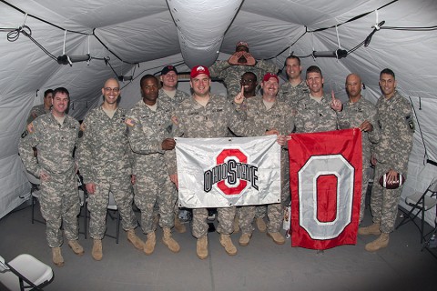 Soldiers deployed in support of Operation United Assistance in Monrovia, Liberia, gather together for a group photo after watching their Ohio State University Buckeyes win the College Football Playoff Championship game, Jan. 13, 2015. The dedicated fans stayed up until 5 a.m. when the game ended. (U.S. Army photo by Sgt. 1st Class Nathan Hoskins, 101st Airborne Division Public Affairs)