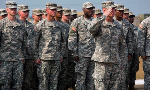 Sgt. 1st Class Anthony Harris, platoon sergeant, 2nd Platoon, Division Signal Company, takes charge of the formation from Maj. Gen. Gary Volesky, the commanding general of the Joint Forces Command – United Assistance and 101st Airborne Division (Air Assault), at the end of the 101st’s color casing ceremony held at the Barclay Training Center, Monrovia, Liberia, Feb. 26, 2015. (Spc. Rashene Mincy, 55th Signal Company (Combat Camera))