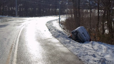 A car that slid off the road due to slick road conditions. (CPD Officer Coz Minetos