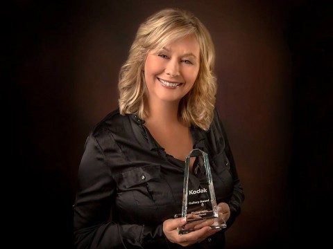 Daphne Treadway with her Kodak Gallery Award for photographic excellence.