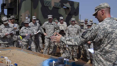 Maj. Hank Coleman, right, the operations officer for the 101st Sustainment Brigade's Task Force Lifeliner, the logistical element for Joint Forces Command – United Assistance in Liberia, host a rehearsal of concept drill for upcoming port operations, Feb. 7, 2015, in Buchanan, Liberia. (Sgt. 1st Class Mary Rose Mittlesteadt, 101st Sustainment Brigade Public Affairs)