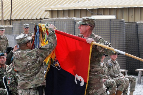 Col. J.B. Vowell (right) and Command Sgt. Maj. Walter Tagalicud (left), the command team for the 3rd Brigade Combat Team “Rakkasans," 101st Airborne Division, unfurl the unit colors during an uncasing ceremony Feb. 15, 2015, in Laghman Province, Afghanistan. The ceremony marked the brigade’s fourth deployment to Afghanistan, now serving as combat advises to Afghan National Security Forces under Train Advise Assist Command-East. (Capt. Charlie Emmons, 3rd BCT Public Affairs)