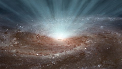 Supermassive black holes at the cores of galaxies blast radiation and ultra-fast winds outward, as illustrated in this artist's conception. (NASA/JPL-Caltech)