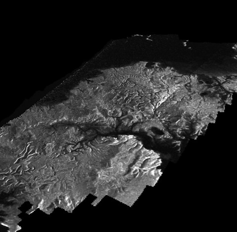 This Cassini Synthetic Aperture Radar (SAR) image is presented as a perspective view and shows a landscape near the eastern shoreline of Kraken Mare, a hydrocarbon sea in Titan's north polar region. (NASA/JPL-Caltech/ASI)