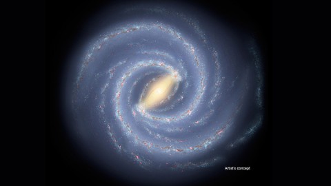 The newfound young star clusters lie thousands of light-years below the plane of our Milky Way galaxy, a flat spiral disk seen in this artist's conception. If alien lifeforms were to develop on planets orbiting these stars, they would have views of a portion, or all, of the galactic disk. (NASA/JPL-Caltech)