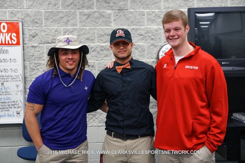 (L to R) Tristan Luke, Charles Talleyrand, and Jim Irwin sign letters of intent Wednesday at a ceremony held at Rossview High School.