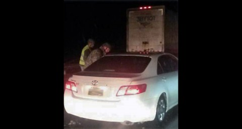 Soldiers from the 267th Military Police Company headquartered in Dickson check the welfare of a motorist stranded on I-40 Friday night. The Soldiers patrolled over 50 miles of highway during the worst of the storm.