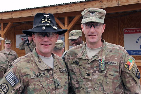 The 3rd Cavalry Regiment commander Col. Cameron Cantlon (left) and 3rd Brigade Combat Team, 101st Airborne Division (Air Assault) Commander Col. J.B. Vowell pose for a photo following the casing and uncasing ceremony held at Tactical Base Gamberi Feb. 15, 2015. (Capt. Jarrod Morris, TAAC-E Public Affairs)